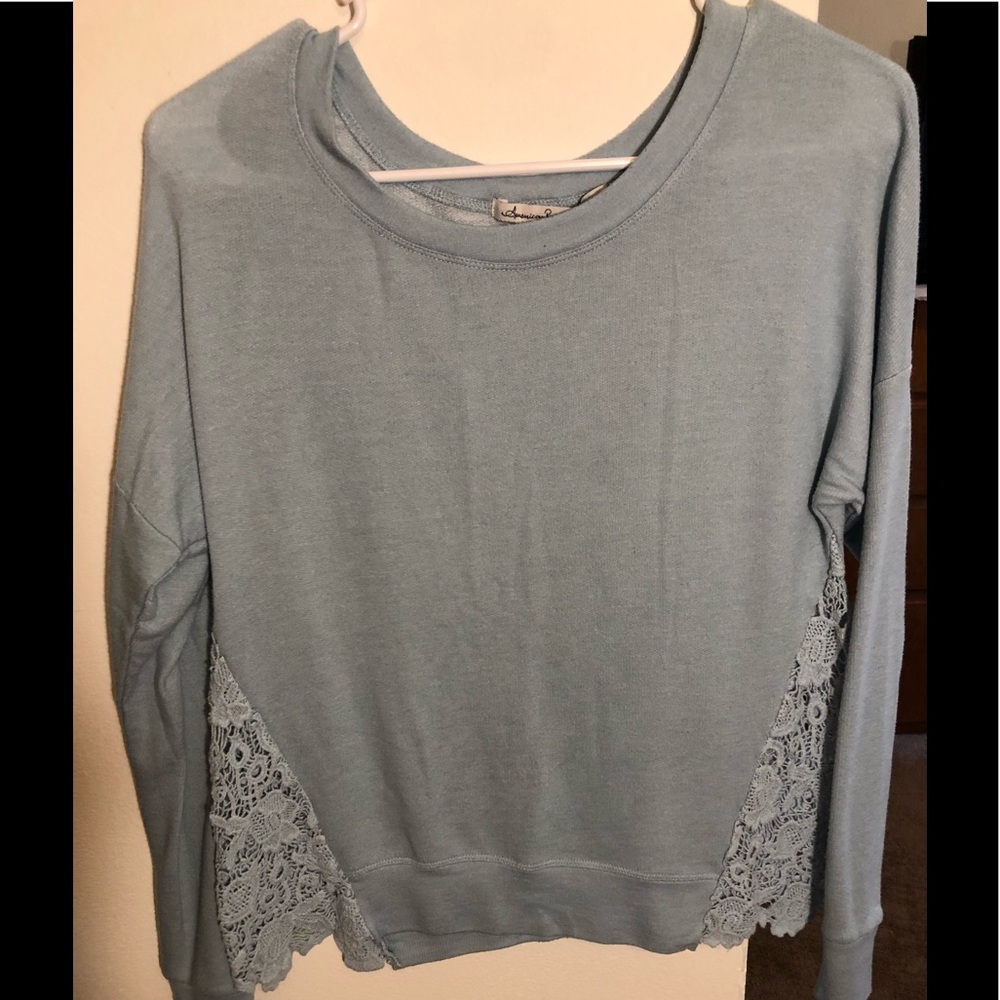 Blue sweater with lace design on sides